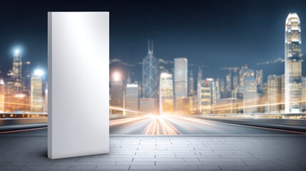 Large blank rectangular billboard standing on city street with illuminated skyscrapers and bright skyline at night