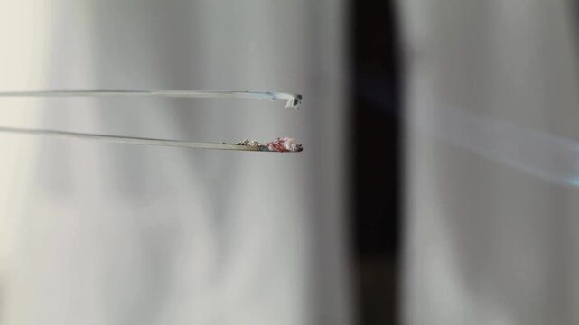 Close-up 4K Ultra HD footage of a combustion reaction, showing flames, sparks, and chemical energy release during a controlled scientific experiment in a laboratory setting.