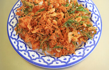Plate of Delicious Deep Fried Shrimp with Ming Aralia Fritters, a Popular Southern Thai Dish