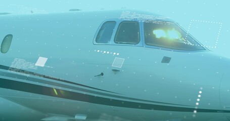 Naklejka premium Displaying private jet nose reflecting sunlight at airfield, with cockpit windows, digital overlay