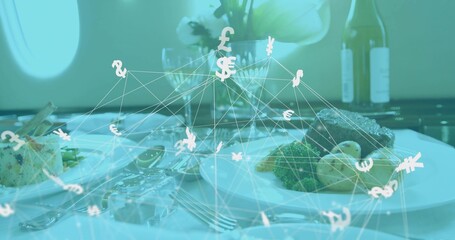 Floating currency network hovering above jet cabin dining table, with gourmet plates and cutlery
