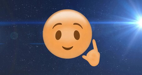 Fototapeta premium Drifting yellow smiley emoji and pointing hand across star field, with lens flares, blue streaks