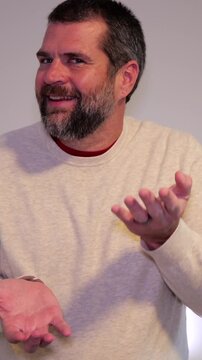 Six-Seven 6-7 67 Meme Trend - Middle Aged Dad Demonstrating Gestures Involved with Latest Craze Among Kids, Tweens, Teens, and Social Media