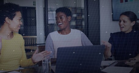 Brainstorming businesswomen sharing ideas in office meeting room, with laptop and tablet