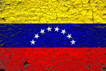 Venezuela flag painted over cracked concrete wall.