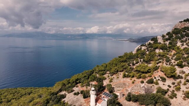 Gelidonya Lighthouse Standing on a Cliff with The Vast Mediterranean Sea Under Cloudy Sky. Kumluca, Antalya - Turkey
