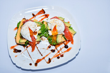 Sandwich with poached eggs and vegetables