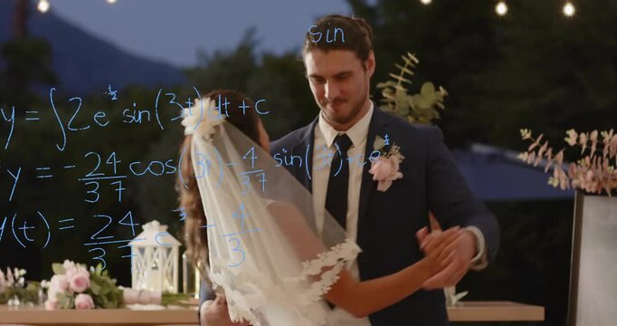Groom extending hand toward bride, guiding wedding dance under candles with math formulas fading