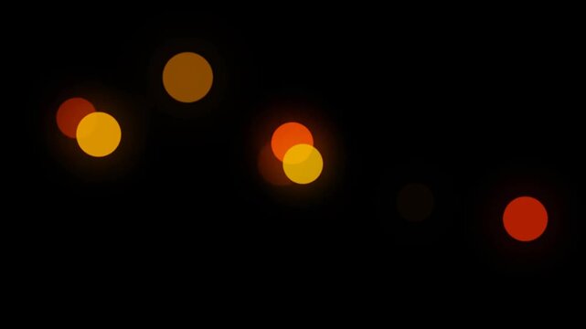 Orange, yellow, and white colors bokeh lights abstract background.