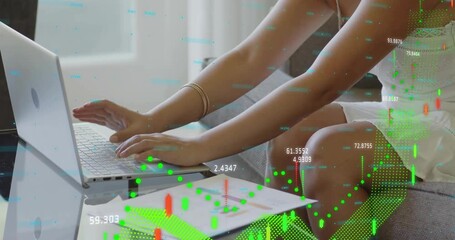 Analyst glancing animated graphs appearing then typing on laptop analyzing market trends on sofa - Powered by Adobe