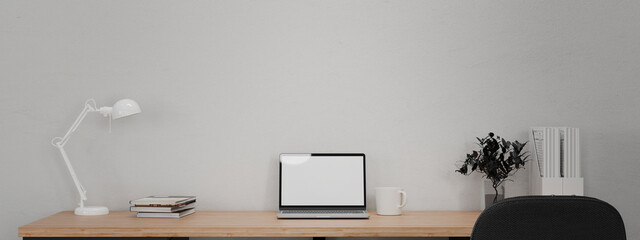 3D render workspace laptop on wooden table with office supply