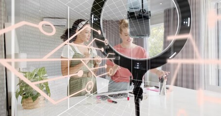 Two hosts switching on ring light and showcasing beauty makeup for tutorial with data overlay - Powered by Adobe