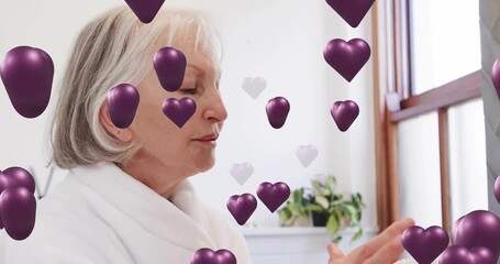 Senior woman reaching for cream jar and initiating skincare routine boosting skin hydration