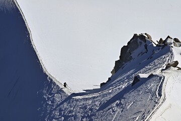 Mountaineer Climbs Over Snowcovered