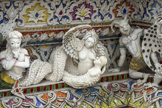 Decorative elements with pop culture references (for example comics, superheroes) in the stucco and porcelain vases outside and inside the art hall with modern art trends such as minimalism and abstraction, Wat Pariwat, Yan Nawa district, Bangkok, Thailand