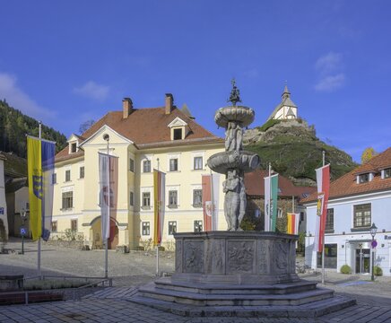 Main square with fountain in the background Filialkirche St. Peter am Petersberg, Friesach, Carinthia, Austria