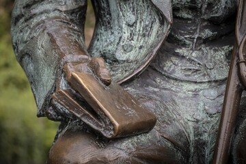 Poet and writer Hans Christian Andersen holding a book in his hands, detail bronze sculpture by Henry Luckow-Nielsen, Hans Christian Andersens Boulevard, Copenhagen, Denmark