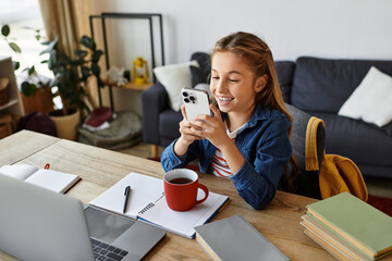 Girl enjoying a casual day at home while using her phone and sipping coffee