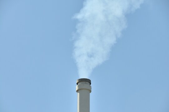 Smoking chimney of a lignite-fuelled combined heat and power plant, Germany