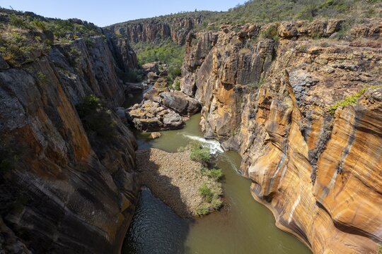 Canyon with steep orange-coloured cliffs with the Blyde River, Bourke's Luck Potholes, Panorama Route, Mpumalanga, South Africa