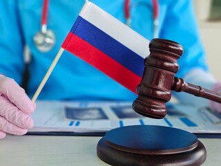 Legal proceedings in healthcare settings with Russian flag and gavel