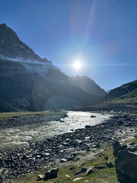 Glacial Serenity: Sunlit River in the Himalayas