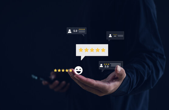 Businessman using smartphone with digital star rating and customer review icons. Concept of user experience, customer satisfaction, online feedback, product review, and service quality evaluation.