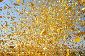 Golden Confetti Exploding in the Sky Celebration and Excitement Event