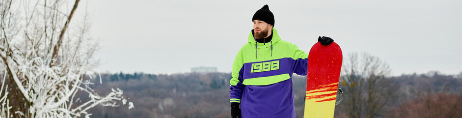 Bearded man enjoying snowboarding on a snowy slope during winter adventures