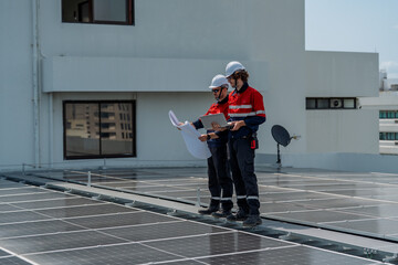 Solar engineer teamwork on rooftop maintenance review boosts clean energy goals under bright sky...