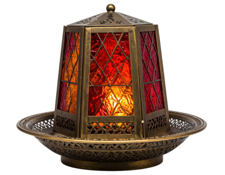 Ornate bronze lantern with stained glass panels, casting warm red and orange light