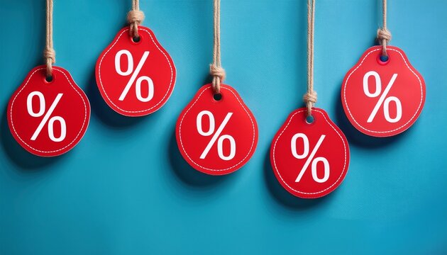 red discount tags hanging from strings against a soft blue background showcasing percentage symbols ideal for promotional marketing sales and retail advertising concepts