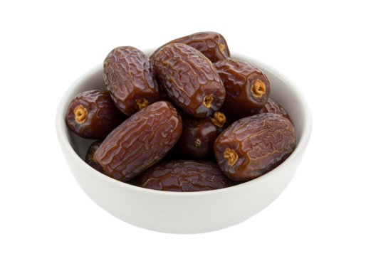 Juicy dates pile in white bowl, healthy sweet snack