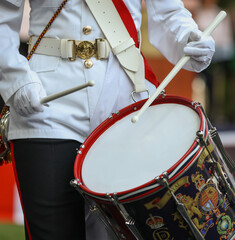 Details with members of UK Royal Marine Corps of Drums performing during an event.