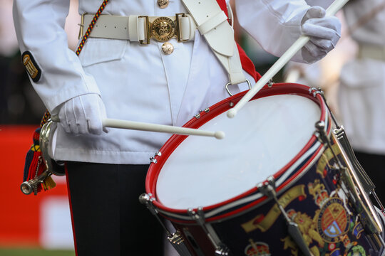 Details with members of UK Royal Marine Corps of Drums performing during an event.