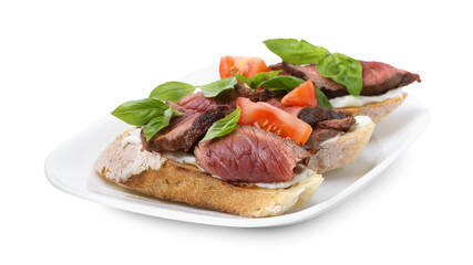 Delicious bruschettas with roast beef, cream cheese, tomatoes and basil isolated on white