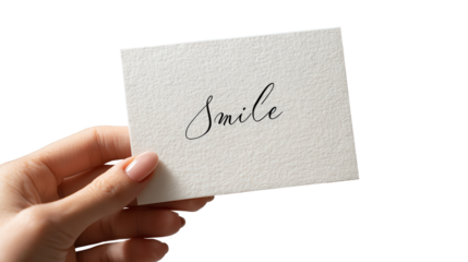 Smile and Hold: A gentle hand delicately holds a card, the word Smile elegantly written. The image invites feelings of positivity, hope, and an optimistic outlook.