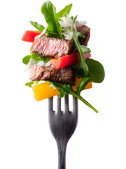 Juicy grilled kebab with vegetables on fork isolated on transparent background, perfect for food and restaurant compositions..