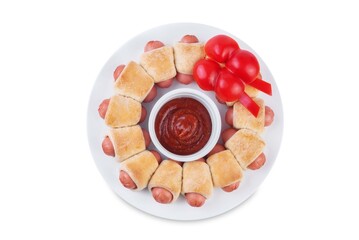 Sausages in dough in the form of Christmas wreath with ketchup sauce for Christmas holidays on a white isolated background