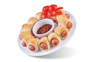 Sausages in dough in the form of Christmas wreath with ketchup sauce for Christmas holidays on a white isolated background