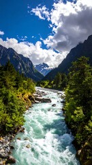 Mountain river rushing through a valley. Lush green vegetation flanks the waterway, framed by towering alpine peaks under a vibrant blue sky with puffy white clouds