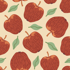 Vector seamless fall pattern with scattered hand drawn rustic red apples and green leaves on beige background. Autumn harvest. Fruit and natural food print for textile, wrapping paper, kitchen decor