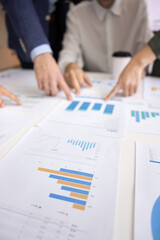 Team of business people working on analytic results