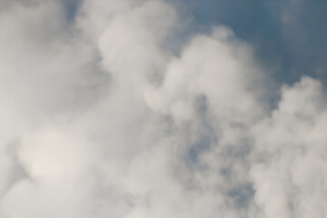 Fototapeta premium cloud abstract background. puffy, cotton-like appearance and flat bases. blue and white cloudscape photography banner. soft heavenly fluffy clouds sky design element with copy space.
