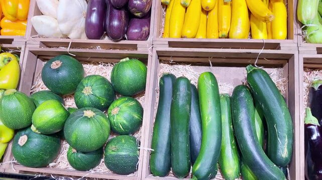 supermarket vegetable counters, various vegetables (pumpkin, zucchini, squash)