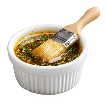 Bbq basting brush dipping into a bowl of marinade or sauce
