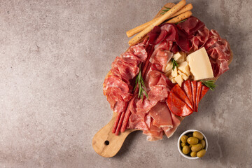 Charcuterie board. Antipasti appetizers of meat platter with salami, prosciutto crudo or jamon and olives.