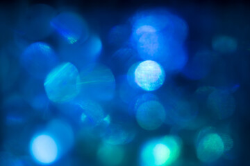 Blue bokeh effect, winter bright holiday light photo for cover design, festive New Year background image, Christmas decoration