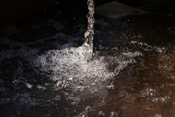 water pouring into a glass