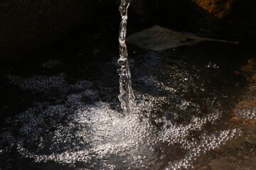 water pouring into a glass